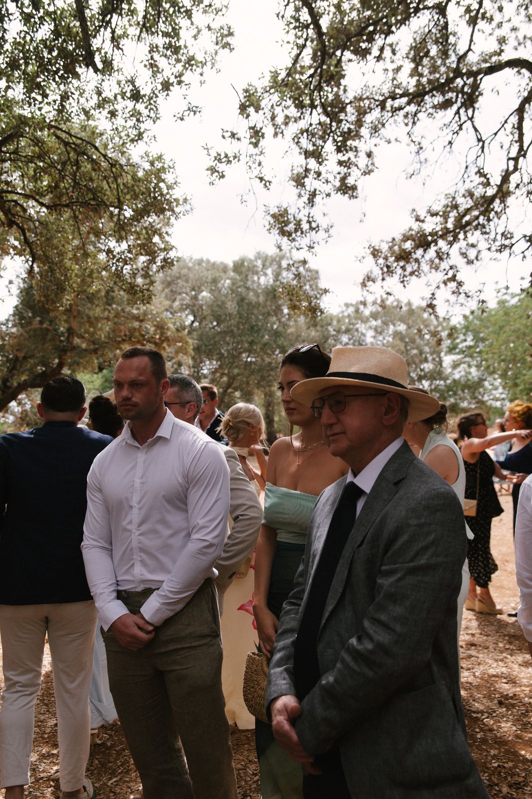 Woodland wedding ceremony under the old trees at Finca Binissatí, Mallorca