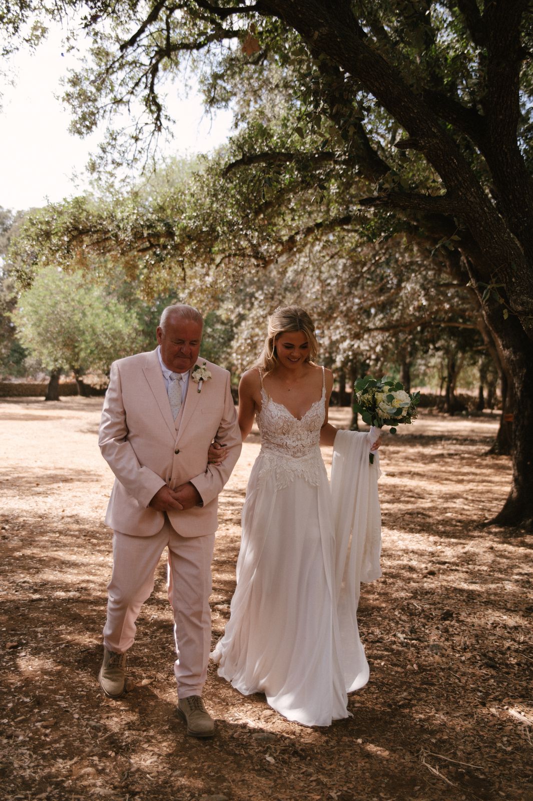 Woodland wedding ceremony under the old trees at Finca Binissatí, Mallorca