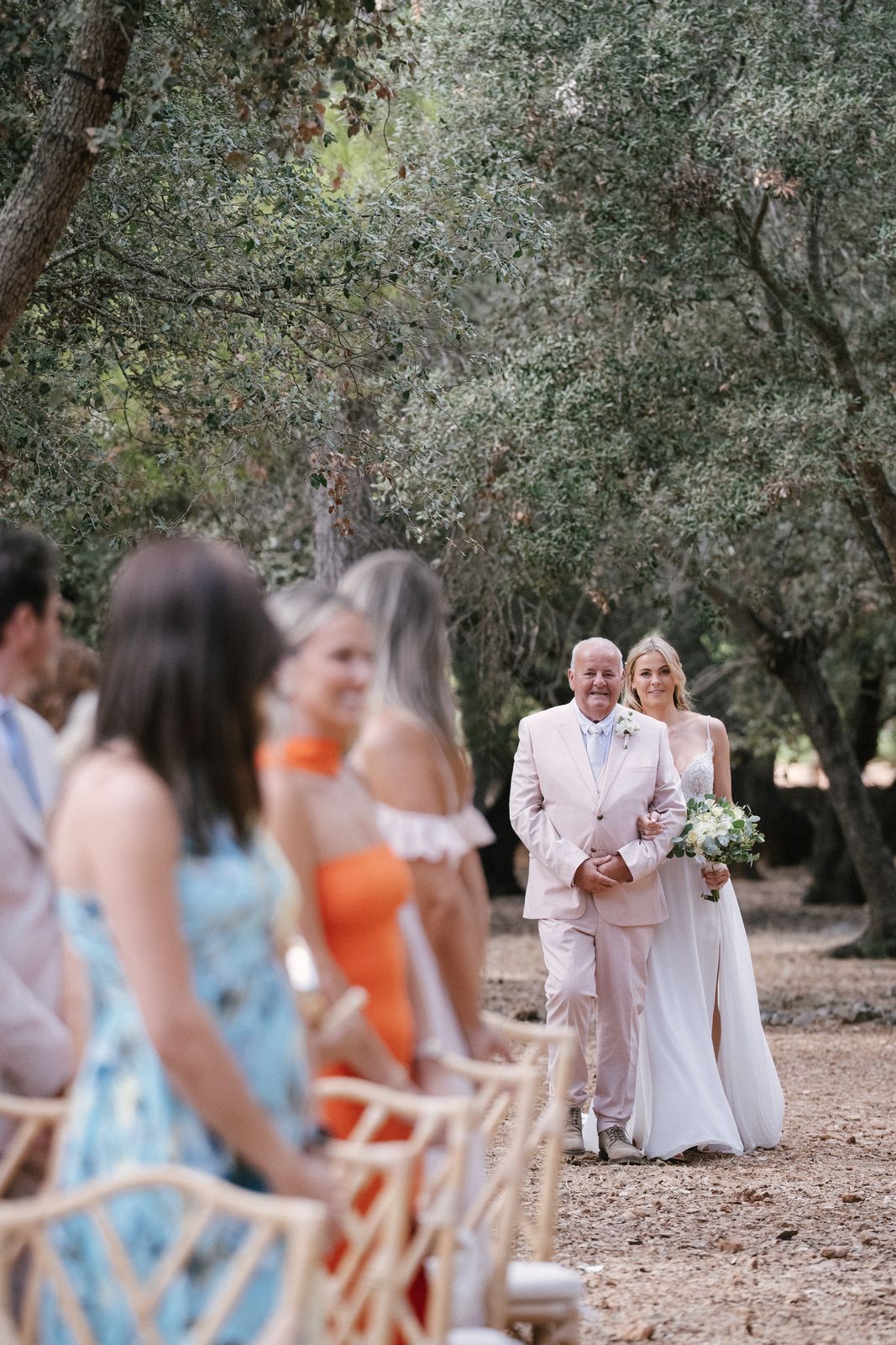 Woodland wedding ceremony under the old trees at Finca Binissatí, Mallorca
