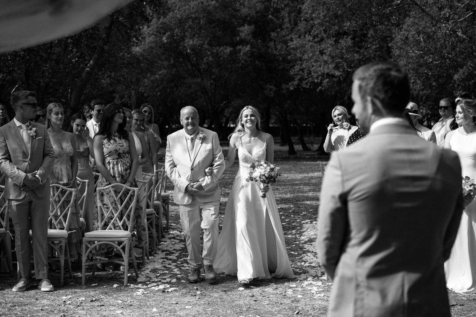 Woodland wedding ceremony under the old trees at Finca Binissatí, Mallorca