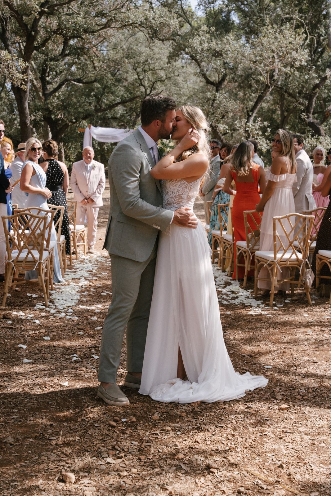 Woodland wedding ceremony under the old trees at Finca Binissatí, Mallorca
