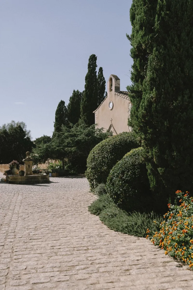 The cobbled path up to the stone chapel between cypresses, Biniagual, Mallorca