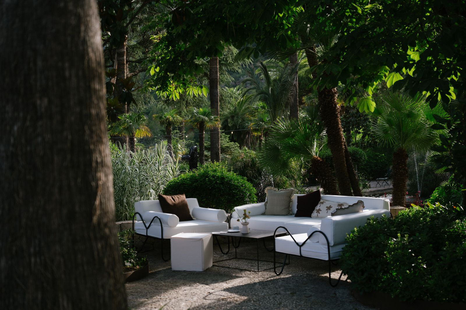 Cocktails under the palm trees at Jardines de Alfabia, Mallorca