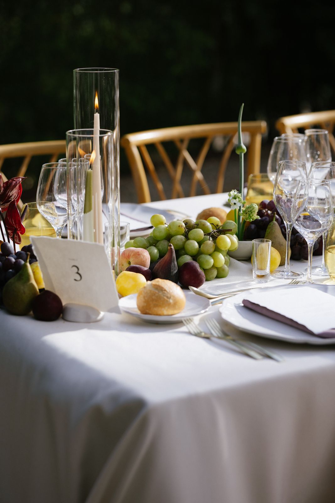 Long tables dressed with figs and peaches at Jardines de Alfabia, Mallorca