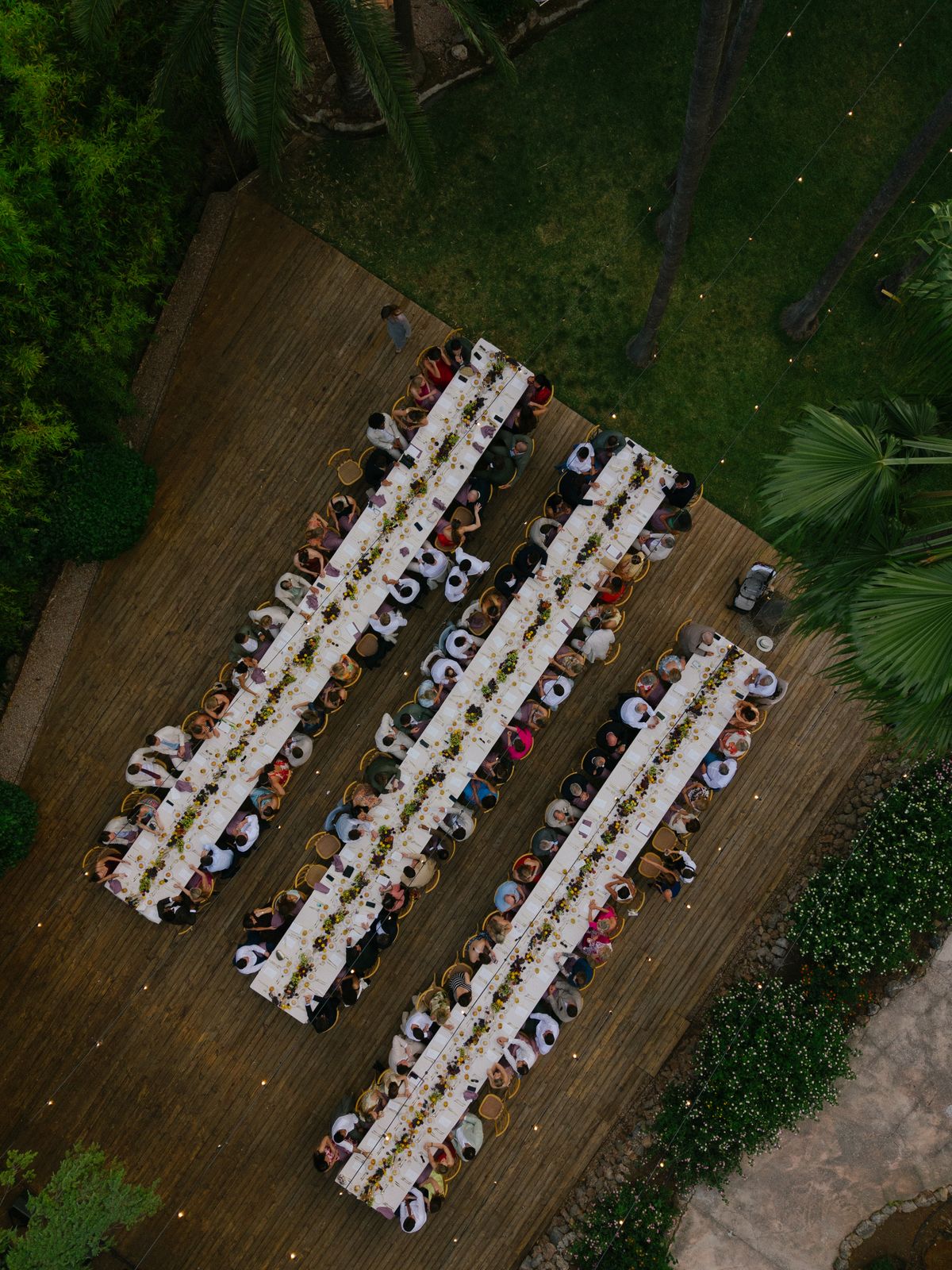 Long tables dressed with figs and peaches at Jardines de Alfabia, Mallorca