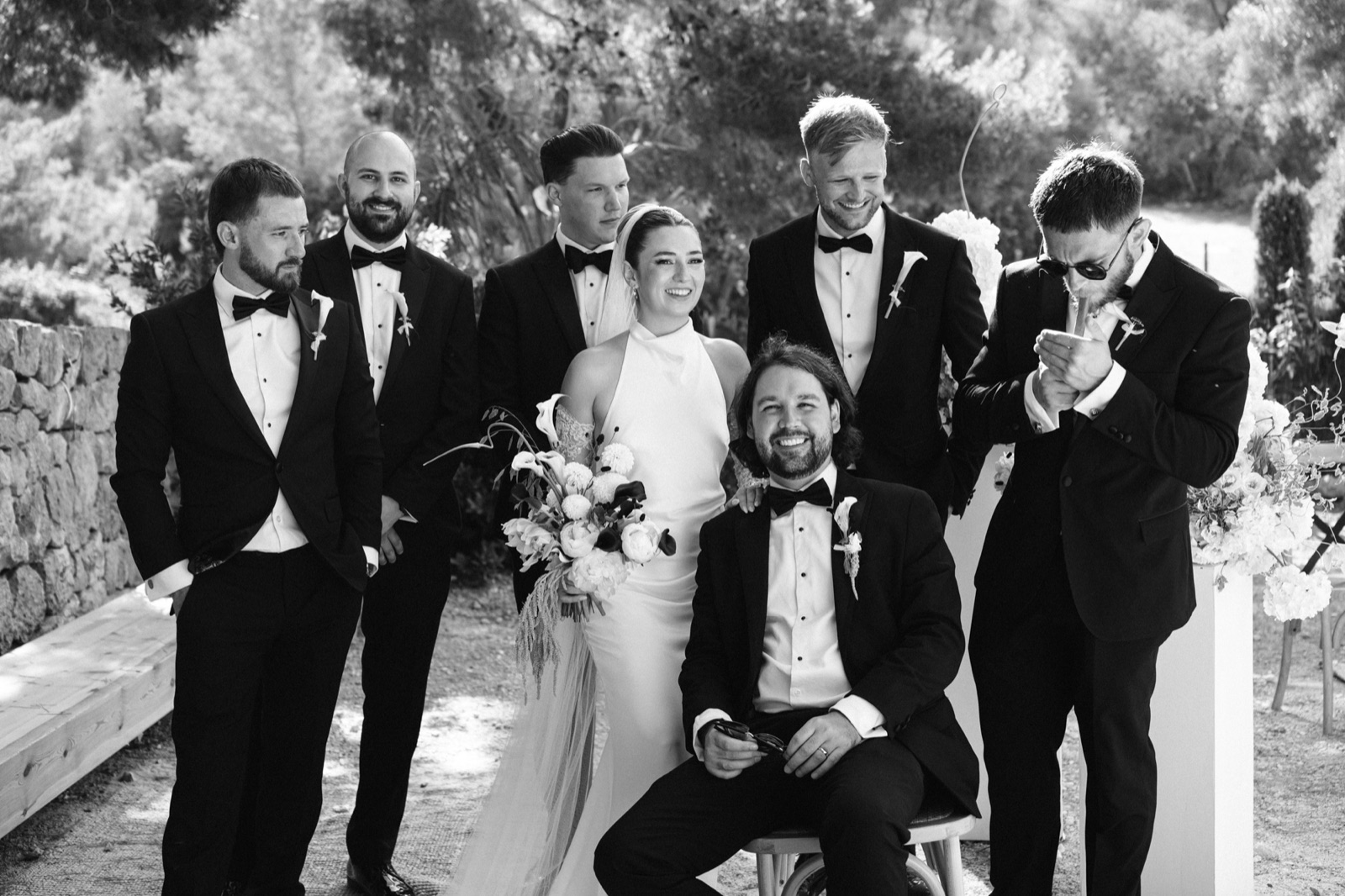 Ellie with her bouquet among the groom and his friends in black tie at Lume & Co, Génova, Mallorca
