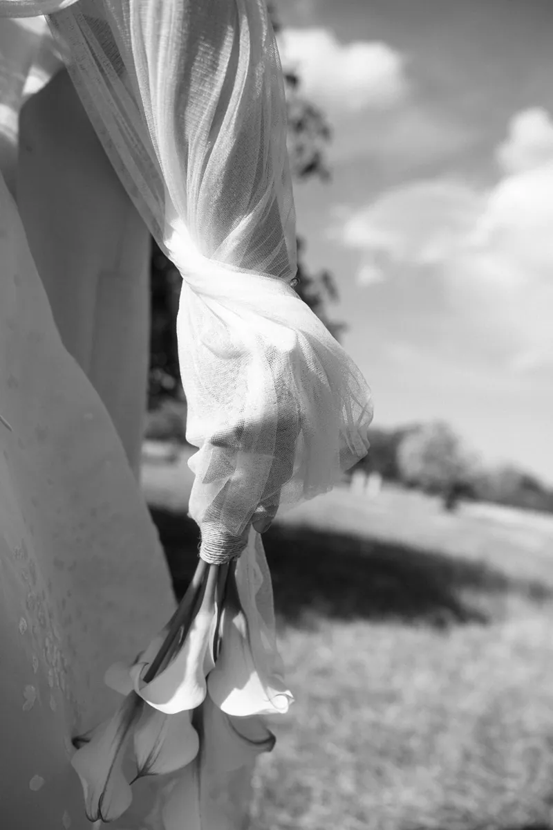 The veil lifting in the wind against the bride’s dress, Finca Binissatí, Mallorca