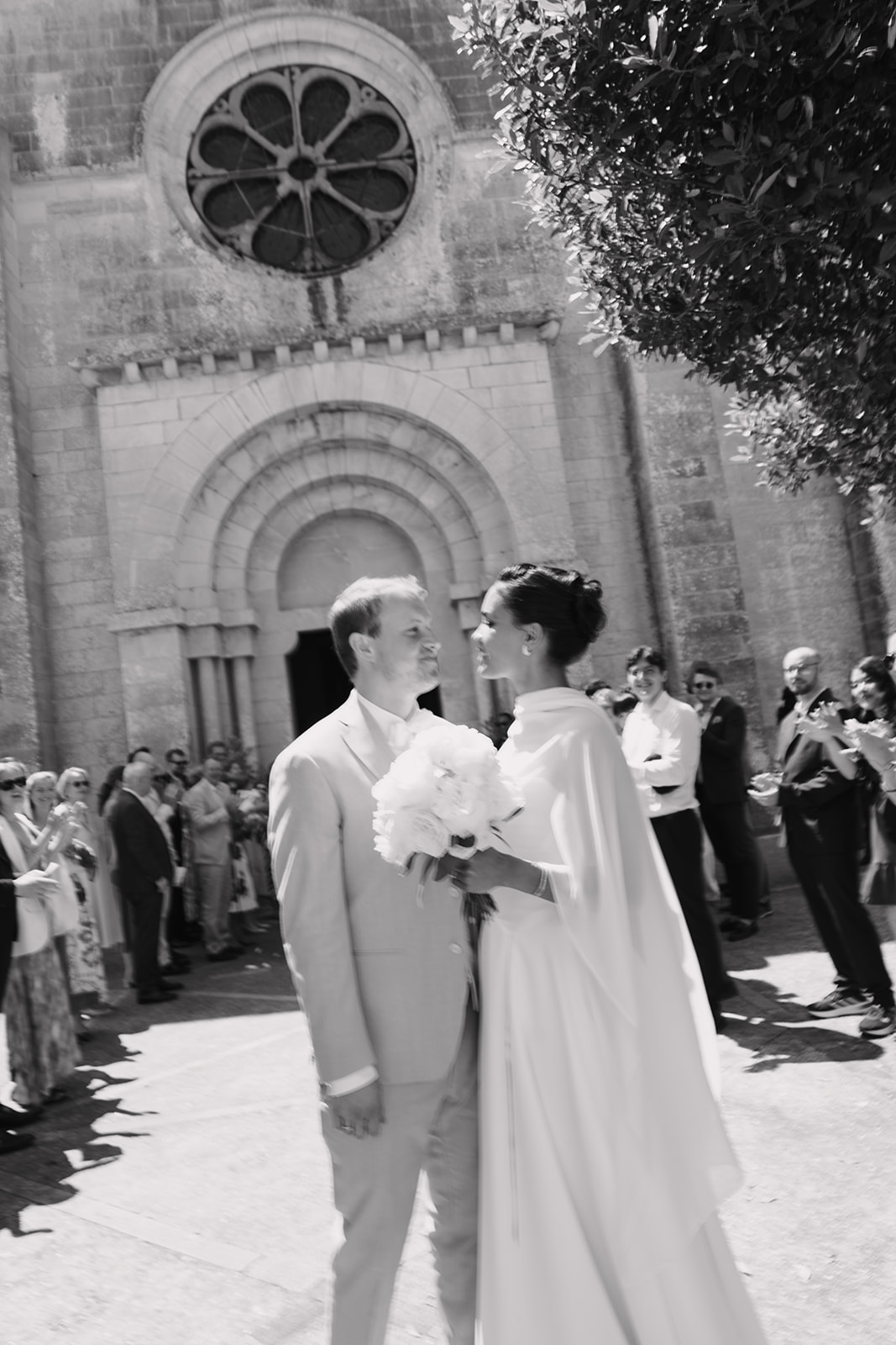 Kassandra and Nikolaus outside the church after the ceremony, guests lining the way, Cala d'Or, Mallorca