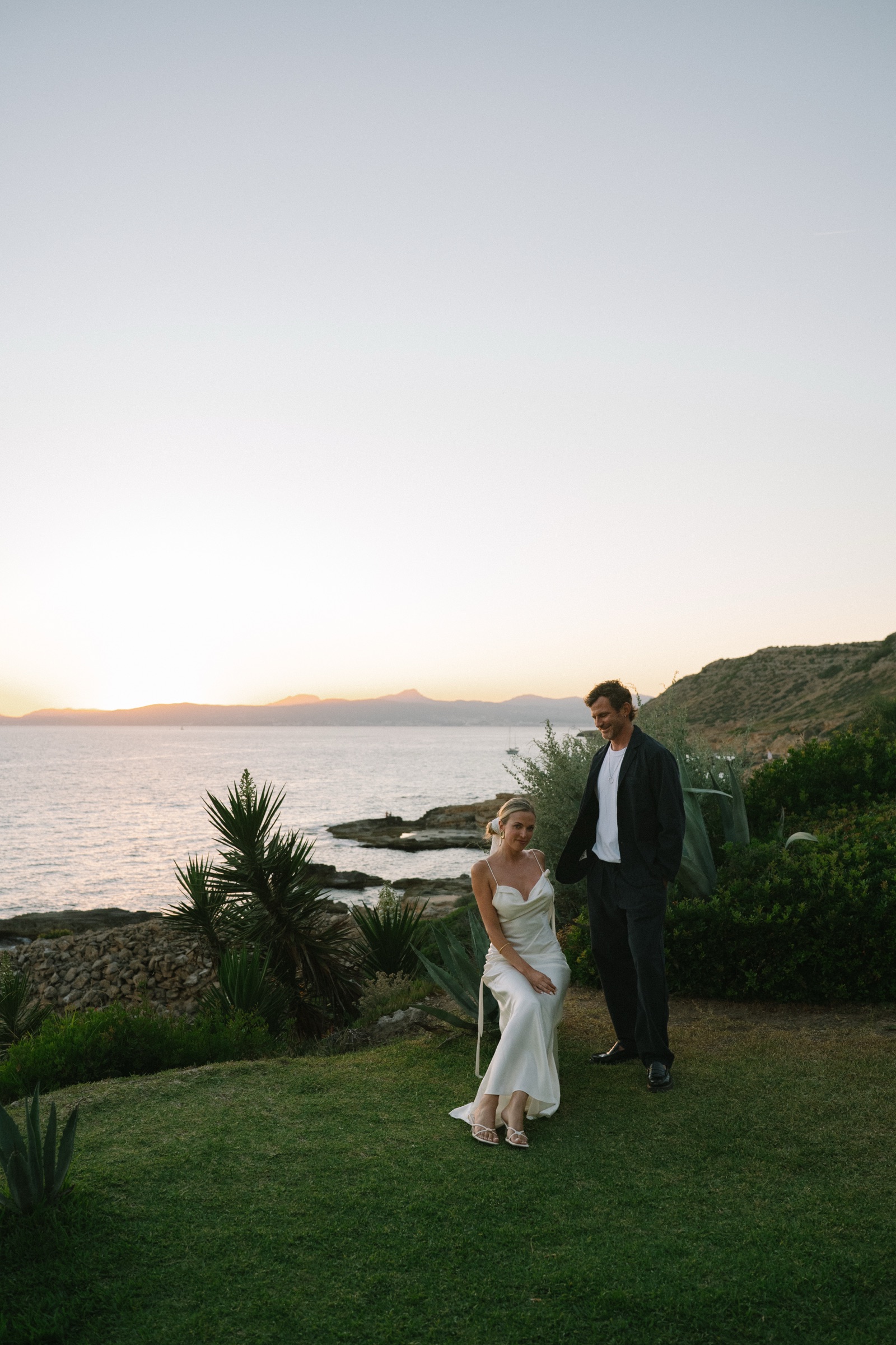 Lucie and Charles at sunset on the lawn above the sea at Son Marroig, Deià, Mallorca