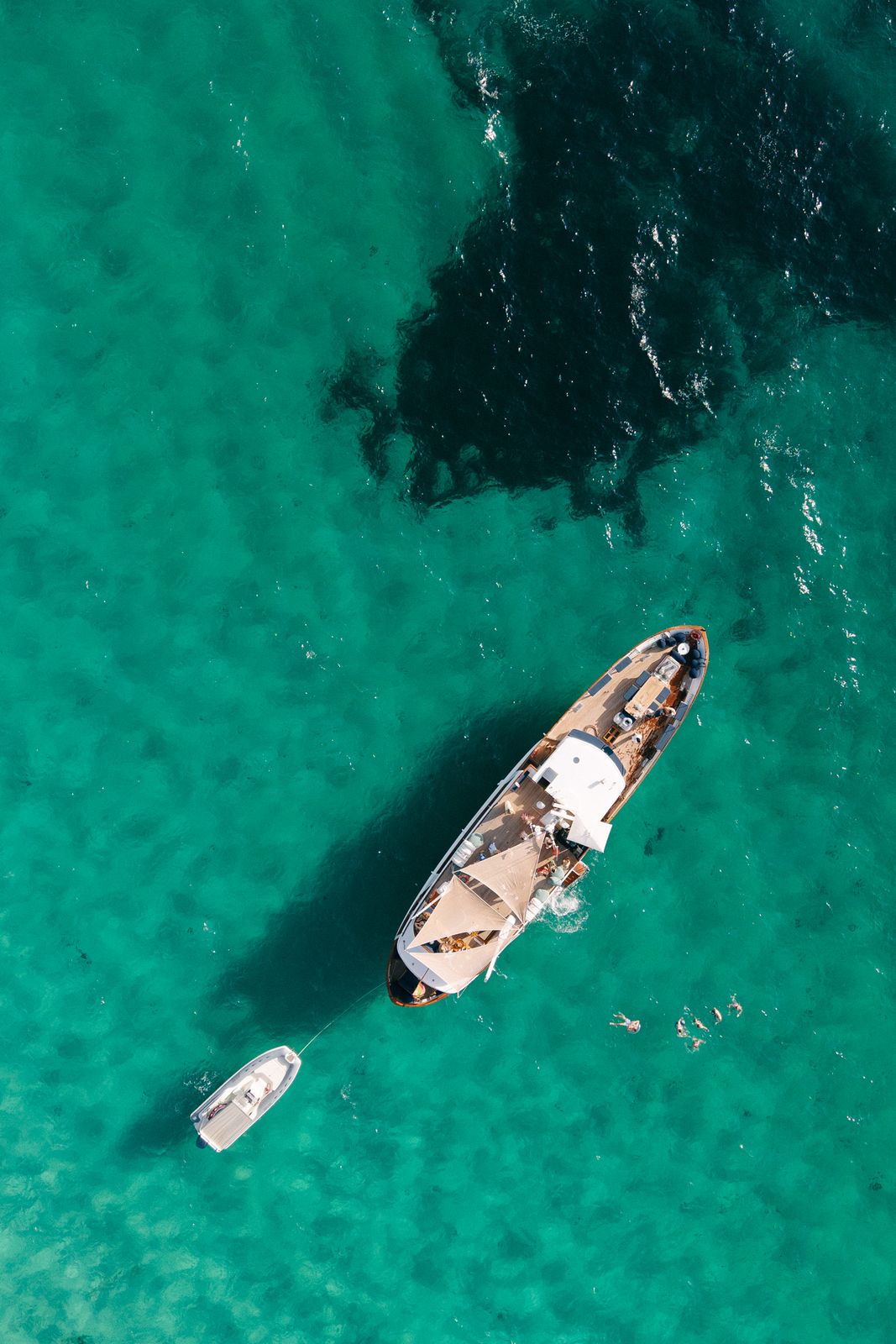 Falcao Uno at anchor in turquoise water, seen from the air, off Palma, Mallorca