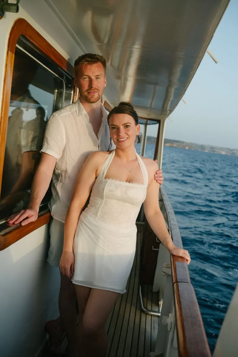 Cake, confetti and dancing on the deck of Falcao Uno at sunset, Mallorca