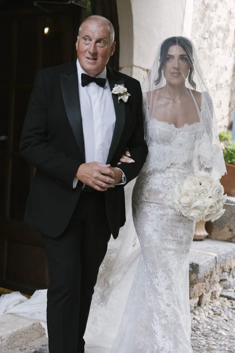 The bride on her father’s arm before the ceremony, Son Marroig, Deià, Mallorca